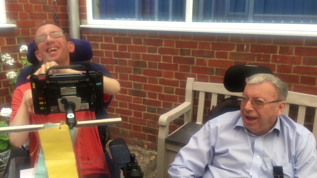 The two participants laughing together