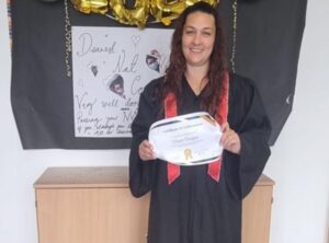 Keyworker in cap and gown